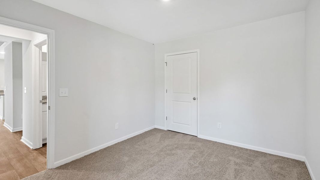 Representative unfurnished interior of a home built from the BAYSHORE by D.R. Horton in Indigo Preserve Townhomes, Leland (Image 33).