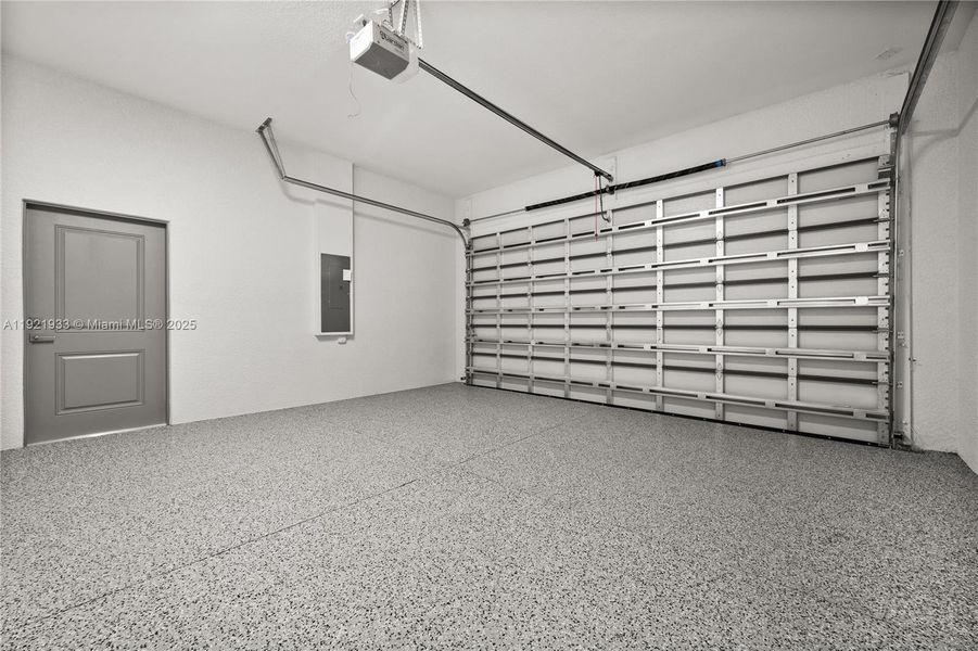 Garage with a garage door opener and electricpanel Garage with a garage door opener and electricpanel