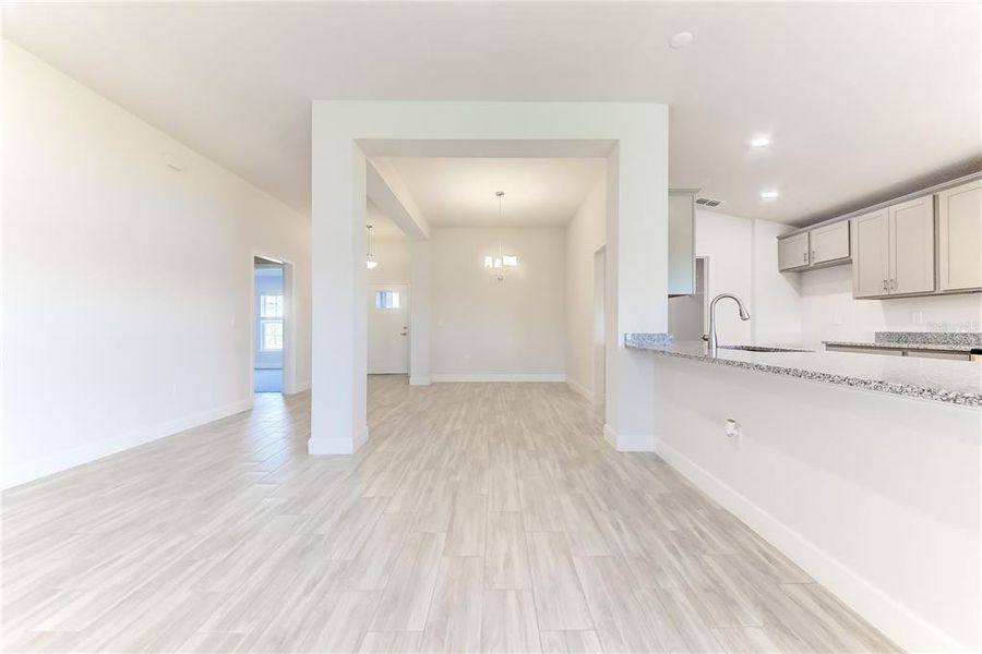 Spacious, unfurnished interior of a new home in Aviary at Rutland Ranch, Parrish (Image 18).