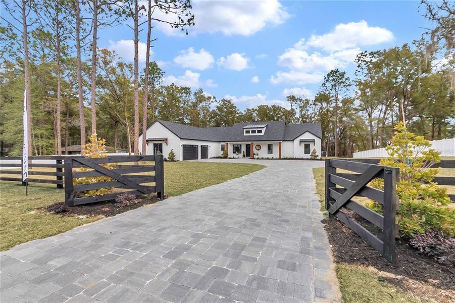 Front exterior of a new home in , Ocala, FL, highlighting curb appeal (Image 1). Front exterior of a new home in , Ocala, FL, highlighting curb appeal (Image 1).
