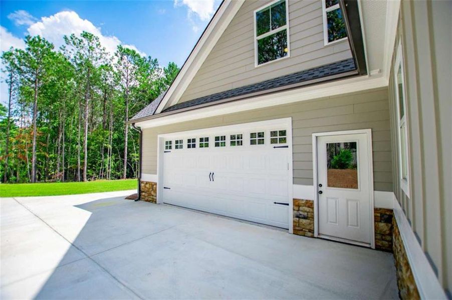 Front exterior of a new home in , Douglasville, GA, highlighting curb appeal (Image 23).