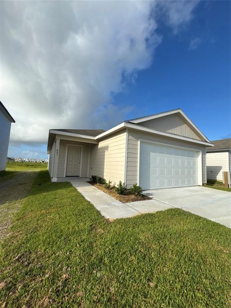 Front exterior of a new home in Santa Fe, Cleveland, TX, highlighting curb appeal (Image 16).
