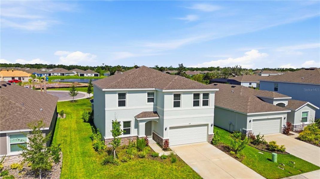 Front exterior of a new home in Coddington, Bradenton, FL, highlighting curb appeal (Image 30).