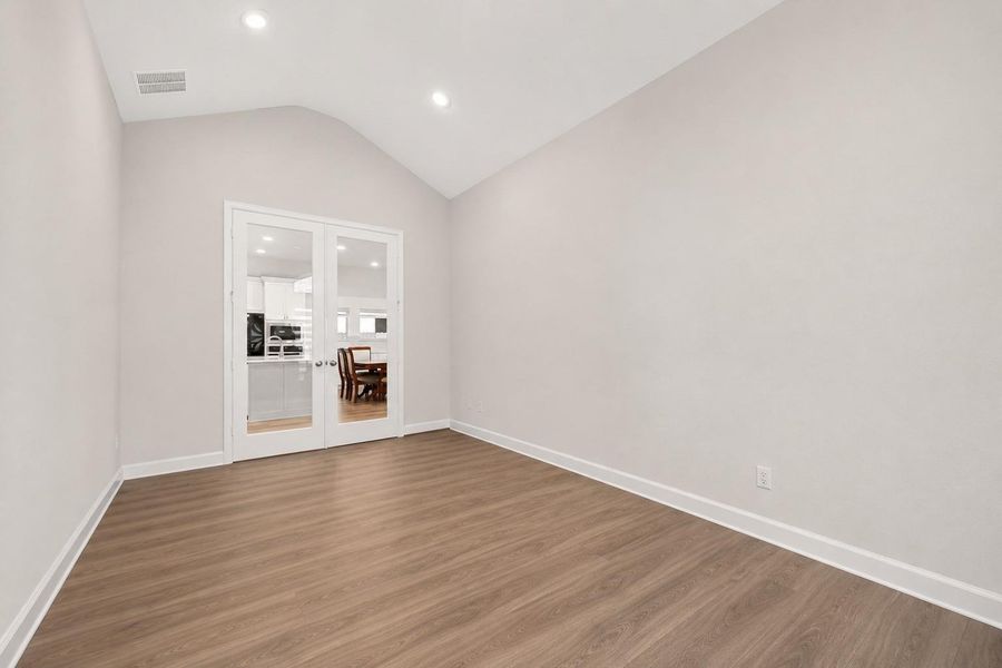 Large game room featuring elegant French glass door entry, offering the perfect space for endless family fun, entertainment, and memorable gatherings Large game room featuring elegant French glass door entry, offering the perfect space for endless family fun, entertainment, and memorable gatherings