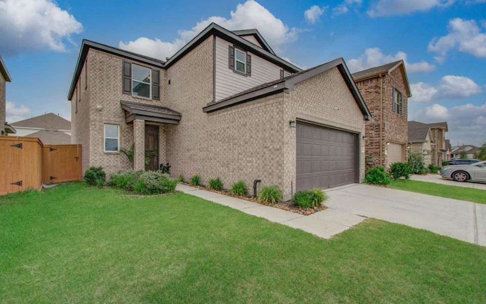 Front exterior of a new home in , Cypress, TX, highlighting curb appeal (Image 1). Front exterior of a new home in , Cypress, TX, highlighting curb appeal (Image 1).