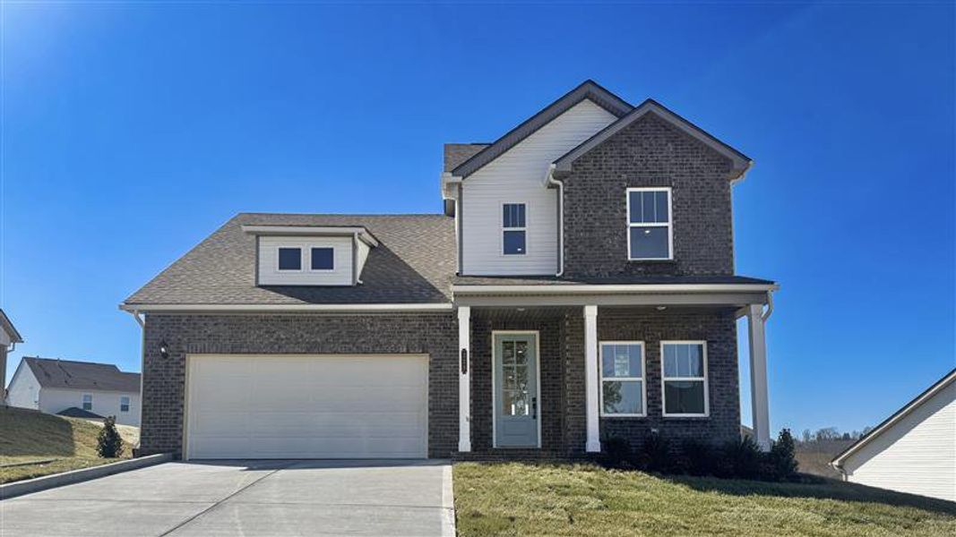 Front exterior of a new home in The Grove at Harrison Glen, Lenoir City, TN, highlighting curb appeal (Image 2). Front exterior of a new home in The Grove at Harrison Glen, Lenoir City, TN, highlighting curb appeal (Image 2).