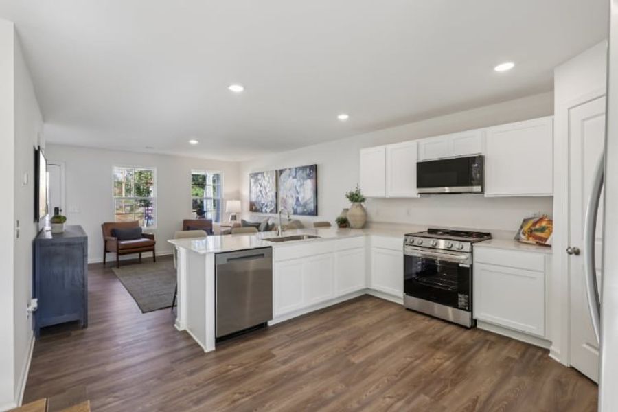 A kitchen with white cabinets. A kitchen with white cabinets.