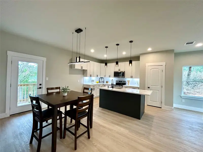 Open concept kitchen, dining, living areas. Open concept kitchen, dining, living areas.