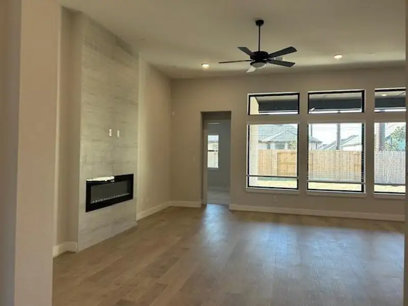Representative picture of family room highlighting an upgraded electric fireplace. Representative picture of family room highlighting an upgraded electric fireplace.