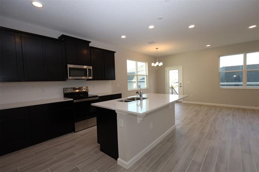Furnished interior view inside a new home in Tribute at Ovation, Winter Garden (Image 13).
