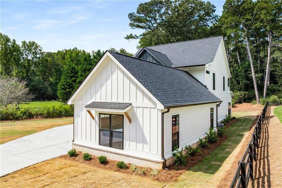 Front exterior of a new home in , Alpharetta, GA, highlighting curb appeal (Image 25). Front exterior of a new home in , Alpharetta, GA, highlighting curb appeal (Image 25).