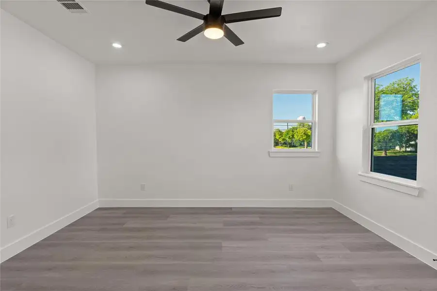 Spare room featuring light wood finished floors, recessed lighting, and ceiling fan