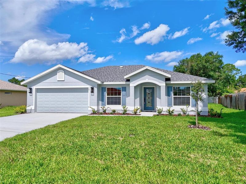 Front exterior of a new home in , Palm Coast, FL, highlighting curb appeal (Image 23).