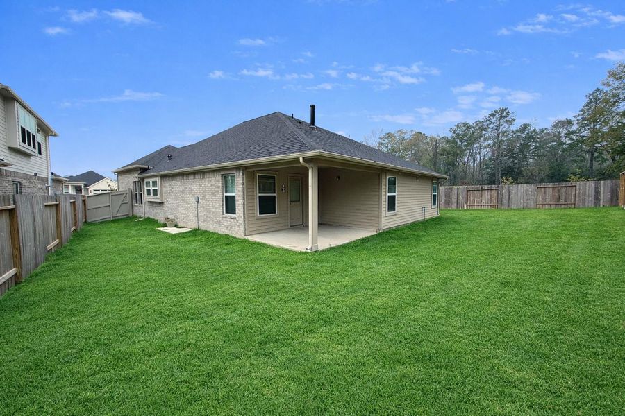 Enjoy the outdoors with coverd back patio and large backyard.