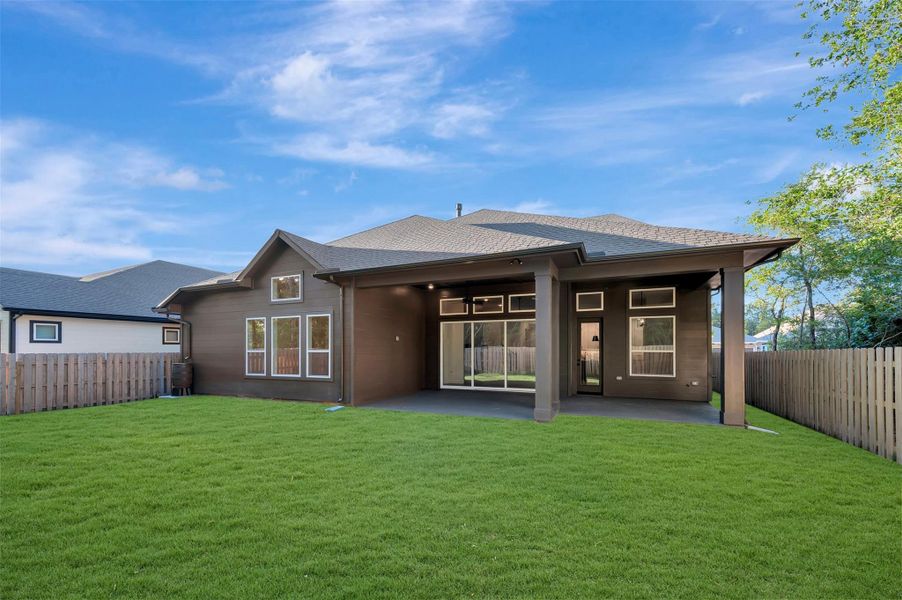 Beautiful back yard that is fully fenced with sprinklers and full gutters and rain barrel!  P-wired for speakers and camera