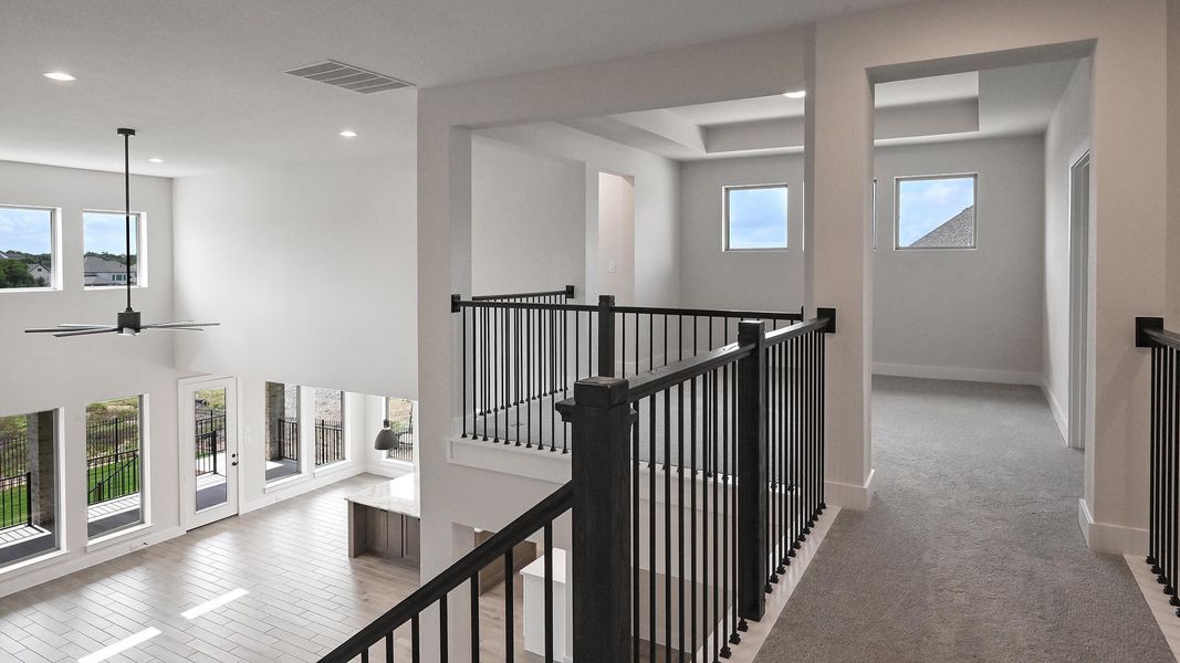 Hallway with an upstairs landing and recessed lighting Hallway with an upstairs landing and recessed lighting