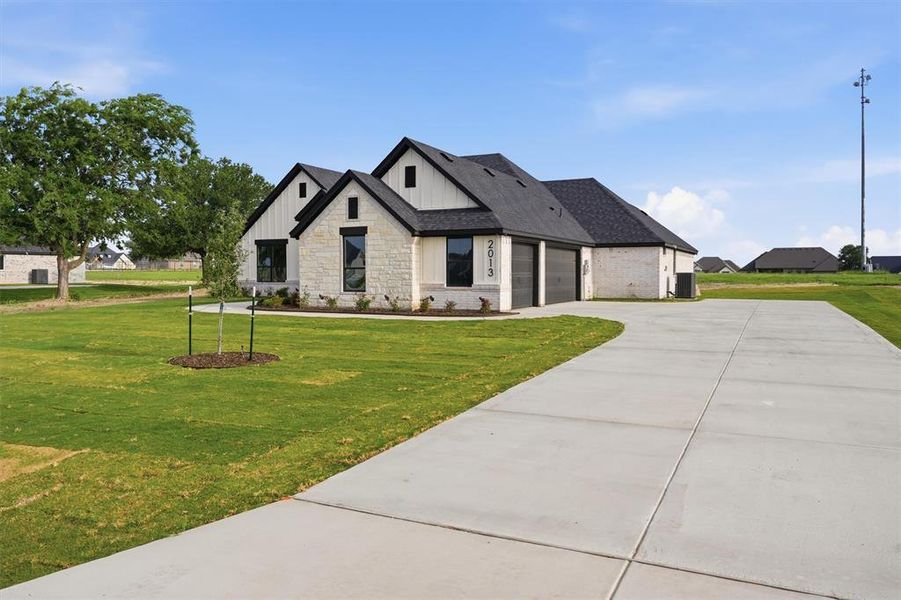 Front exterior of a new home in , Weatherford, TX, highlighting curb appeal (Image 22). Front exterior of a new home in , Weatherford, TX, highlighting curb appeal (Image 22).