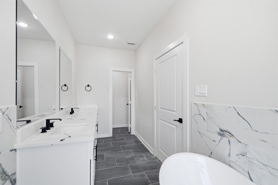 Ensuite bathroom with dual sinks, soaking tub and oversized shower Ensuite bathroom with dual sinks, soaking tub and oversized shower