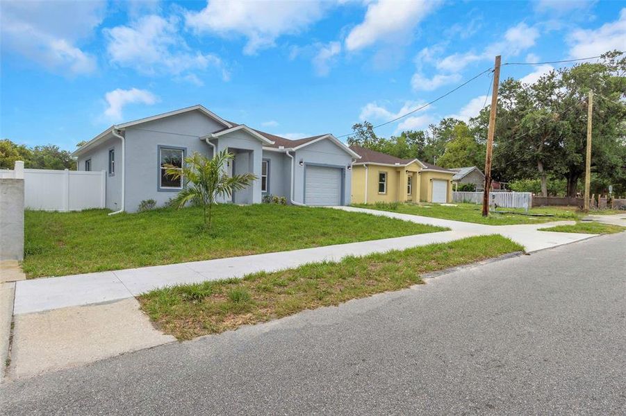Front exterior of a new home in , Tampa, FL, highlighting curb appeal (Image 26).