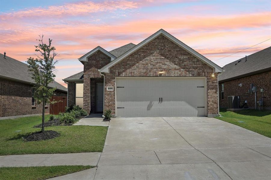 Front exterior of a new home in , Lavon, TX, highlighting curb appeal (Image 2). Front exterior of a new home in , Lavon, TX, highlighting curb appeal (Image 2).