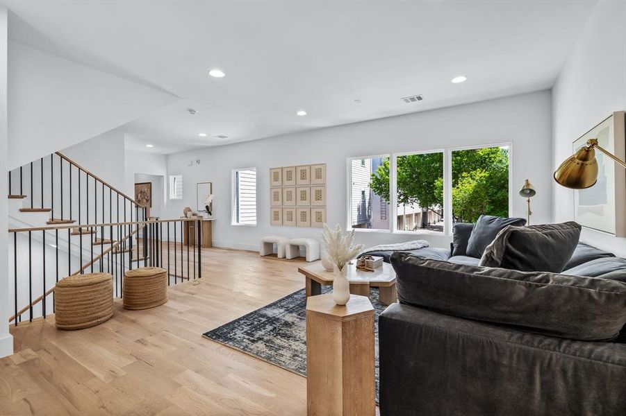 Living room with light hardwood / wood-style flooring