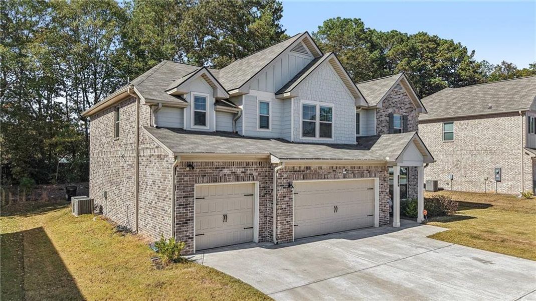 Front exterior of a new home in North Hampton, Hampton, GA, highlighting curb appeal (Image 24).