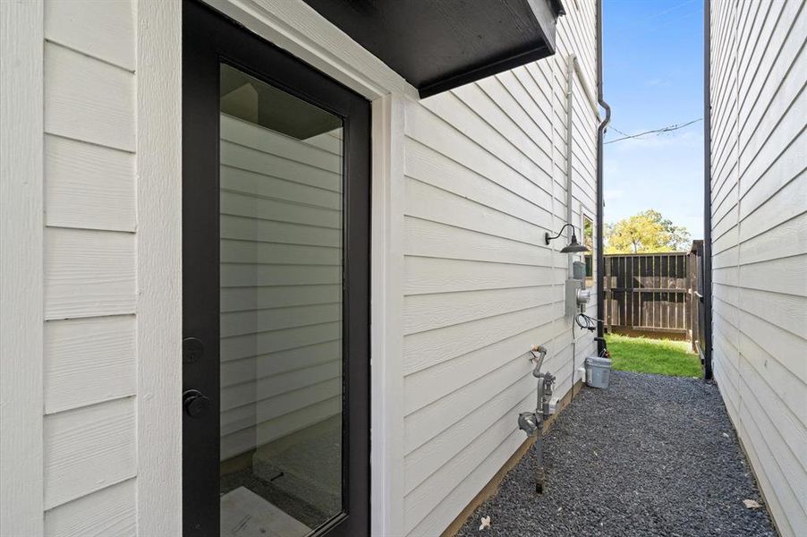 Private glass side-door entry way to the home.