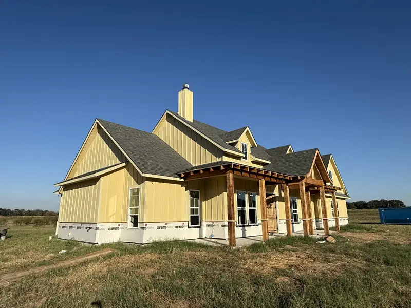 Front exterior of a new home in Oak Water Ranch, Granbury, TX, highlighting curb appeal (Image 4).