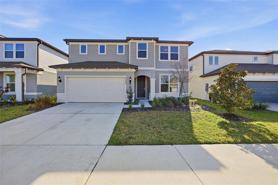 Front exterior of a new home in Marion Ranch, Ocala, FL, highlighting curb appeal (Image 2).