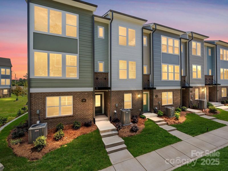 Front exterior of a new home in Central Living at Craig, Charlotte, NC, highlighting curb appeal (Image 21).