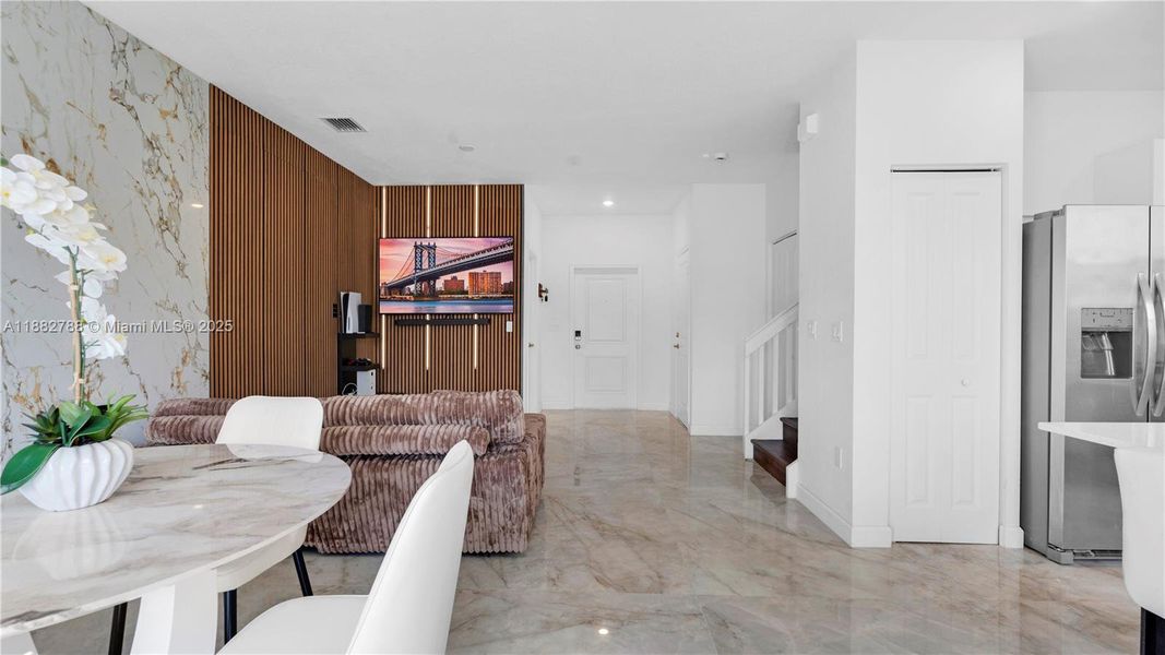 Upgraded porcelain tile flooring & LED-lit porcelain accent wall