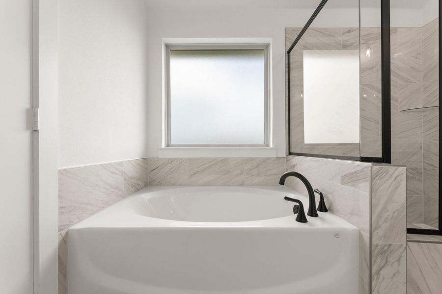 Furnished interior view inside a new home in Cottage Collection at Harvest, Argyle (Image 12).