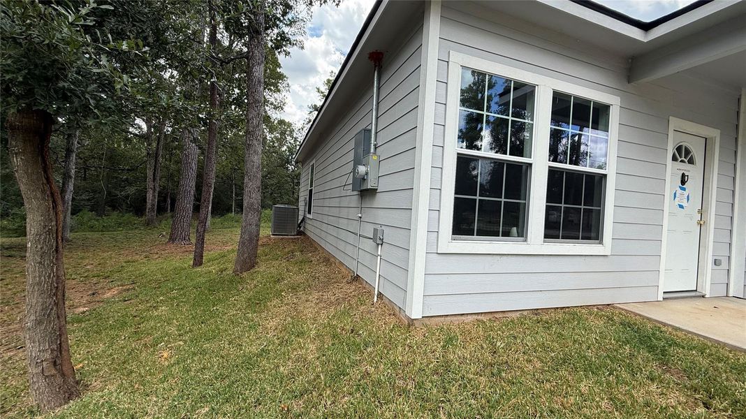 Exterior details and patio area of a home in , Conroe (Image 18).