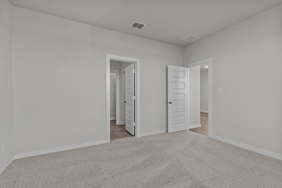A hallway with white walls.
