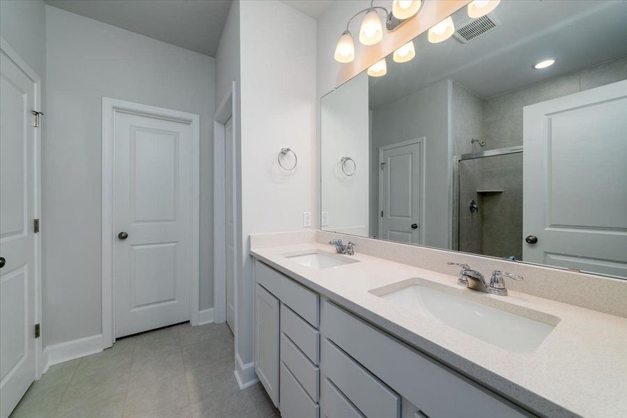 Owner's Bath with shower and dual-sink vanity. Owner's Bath with shower and dual-sink vanity.