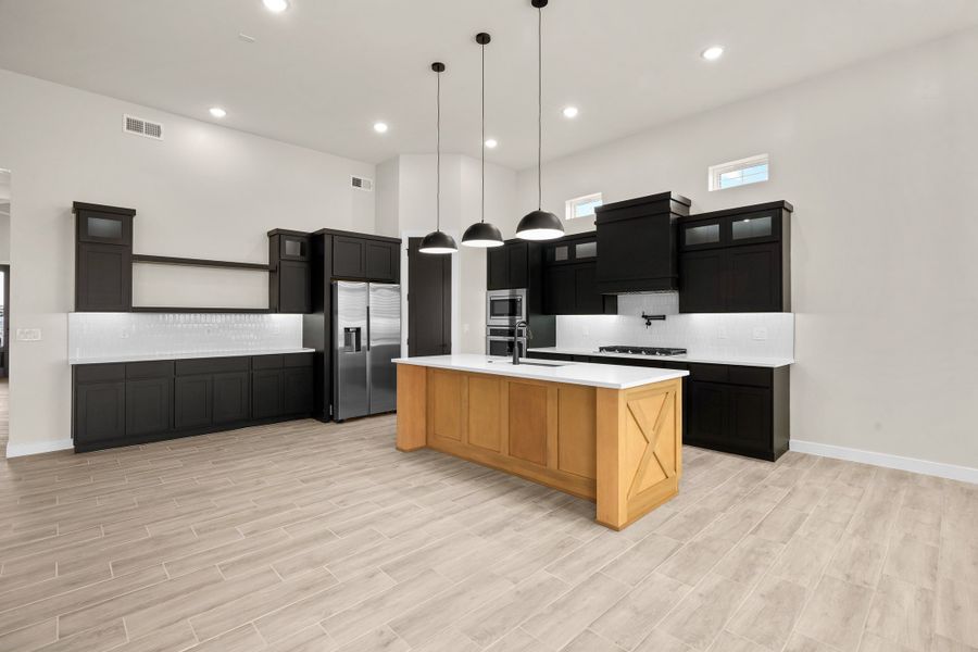 Representative furnished interior of a home built from the Pebble Beach- II by LEH. Homes in Verdancia, El Paso (Image 8).
