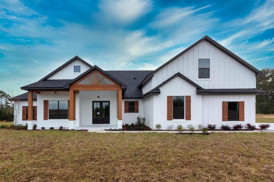 Front exterior of a new home in , Umatilla, FL, highlighting curb appeal (Image 30).
