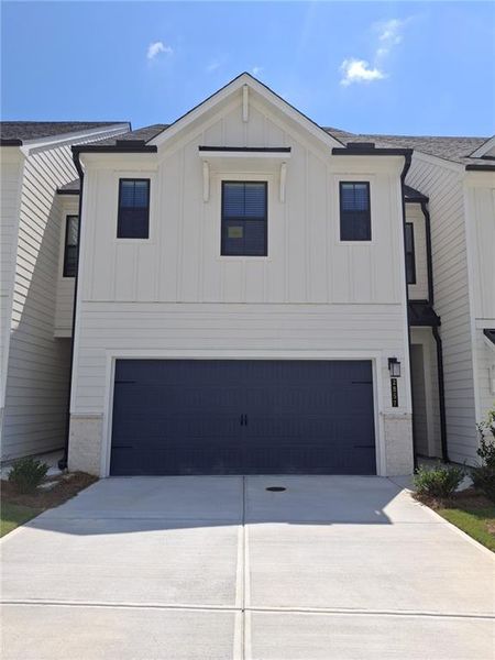 Front exterior of a new home in The Reserve at Gainesville Township, Gainesville, GA, highlighting curb appeal (Image 2). Front exterior of a new home in The Reserve at Gainesville Township, Gainesville, GA, highlighting curb appeal (Image 2).