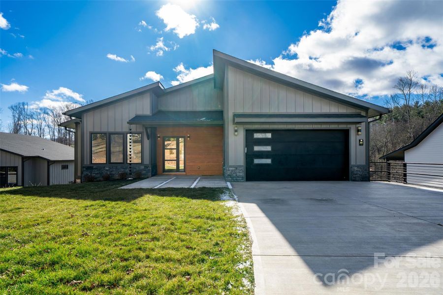 Front exterior of a new home in , Arden, NC, highlighting curb appeal (Image 24).