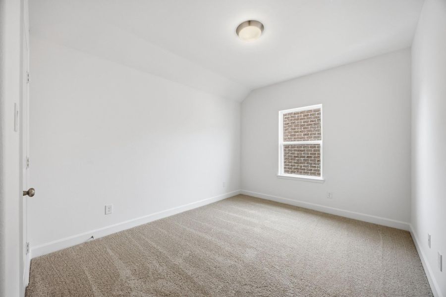 Welcoming Rooms: A Secondary Bedroom serves as a polished oasis for guests or family.