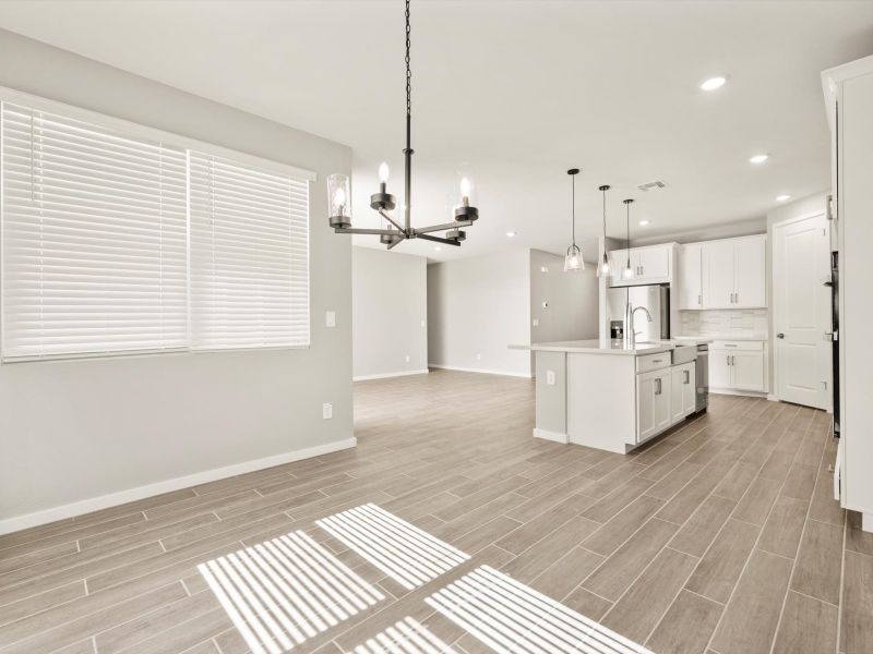 Spacious, unfurnished interior of a new home in Blossom Rock Reserve Series, Apache Junction (Image 8).