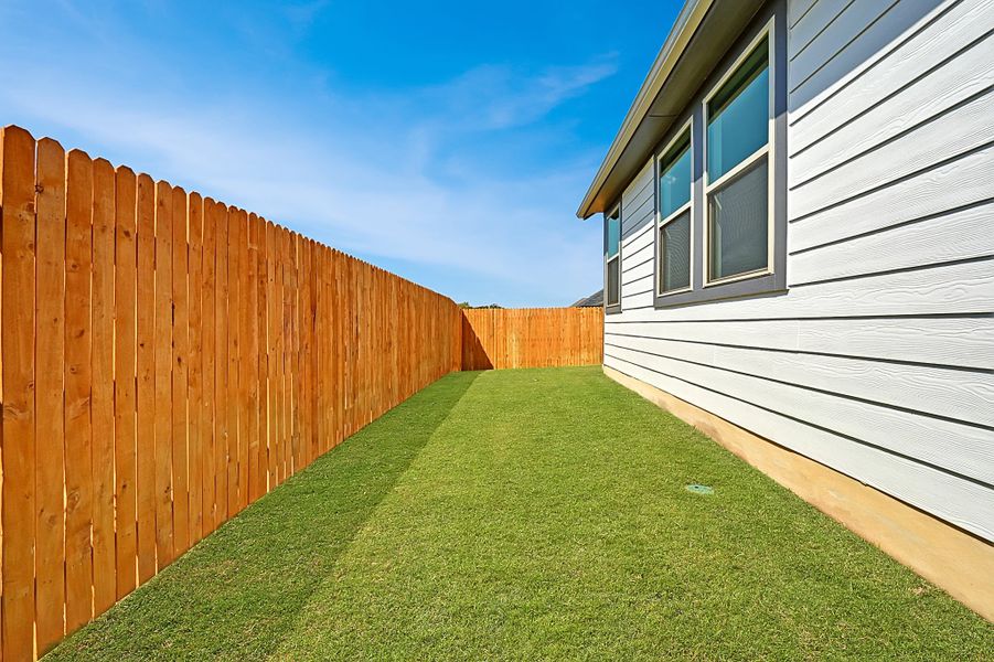 Exterior details and patio area of a home in Trinity Ranch, Elgin (Image 19).