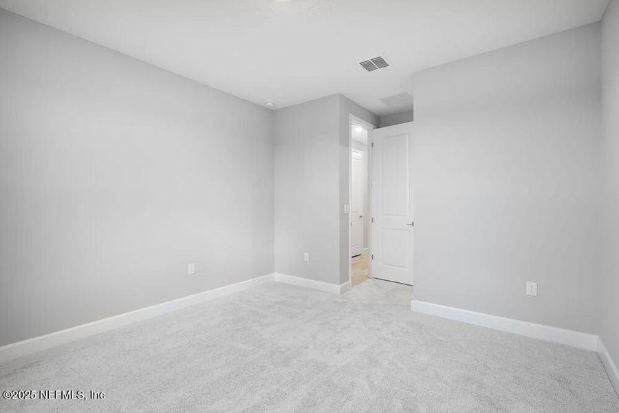 Spacious, unfurnished interior of a new home in Colbert Landings, Palm Coast (Image 28).