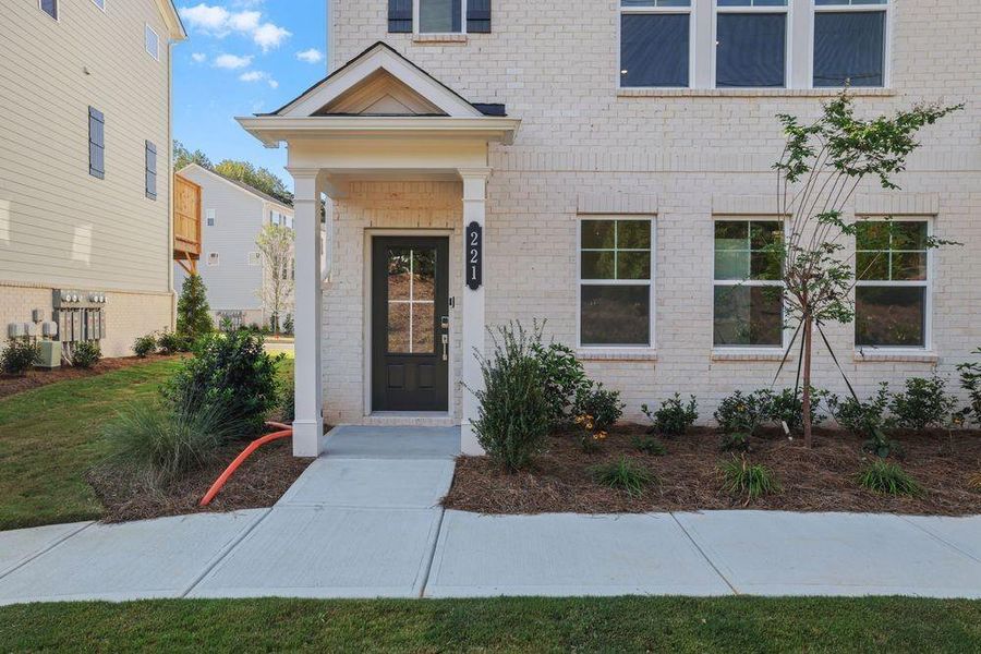 Front exterior of a new home in Somerset at Veterans Memorial, Mableton, GA, highlighting curb appeal (Image 2). Front exterior of a new home in Somerset at Veterans Memorial, Mableton, GA, highlighting curb appeal (Image 2).