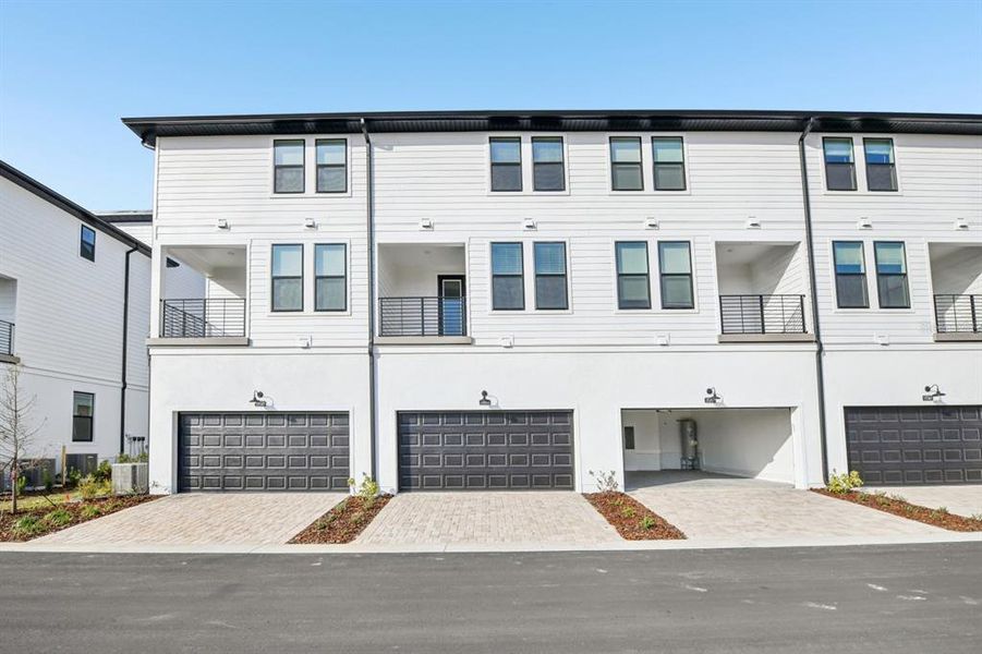 Front exterior of a new home in Parkview at Hamlin, Winter Garden, FL, highlighting curb appeal (Image 22). Front exterior of a new home in Parkview at Hamlin, Winter Garden, FL, highlighting curb appeal (Image 22).