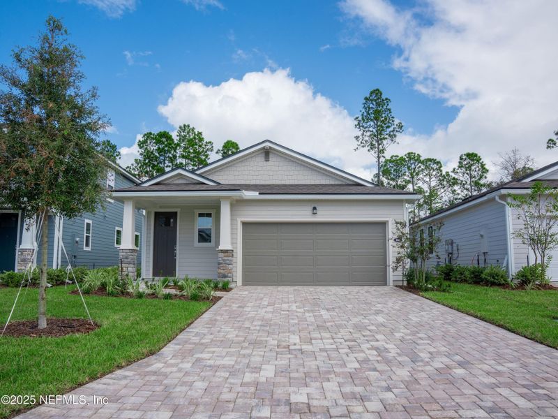 Front exterior of a new home in RiverTown - Forest, St. Johns, FL, highlighting curb appeal (Image 1). Front exterior of a new home in RiverTown - Forest, St. Johns, FL, highlighting curb appeal (Image 1).