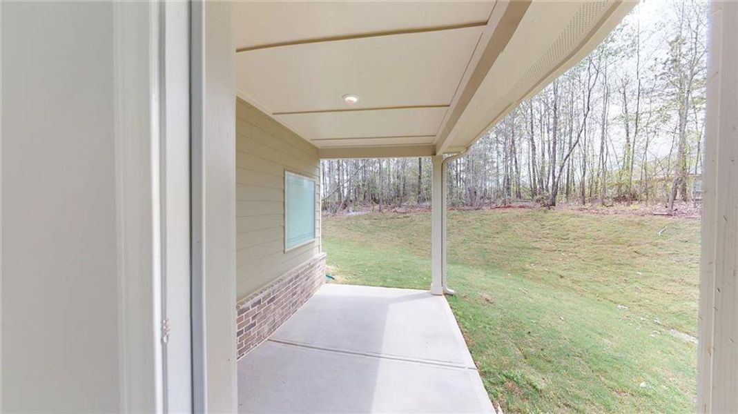 Exterior details and patio area of a home in Mirror Lake at South Harbour, Villa Rica (Image 4).