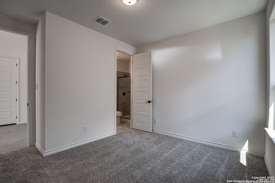 Spacious, unfurnished interior of a new home in The Reserve at Potranco Oaks, Castroville (Image 22).