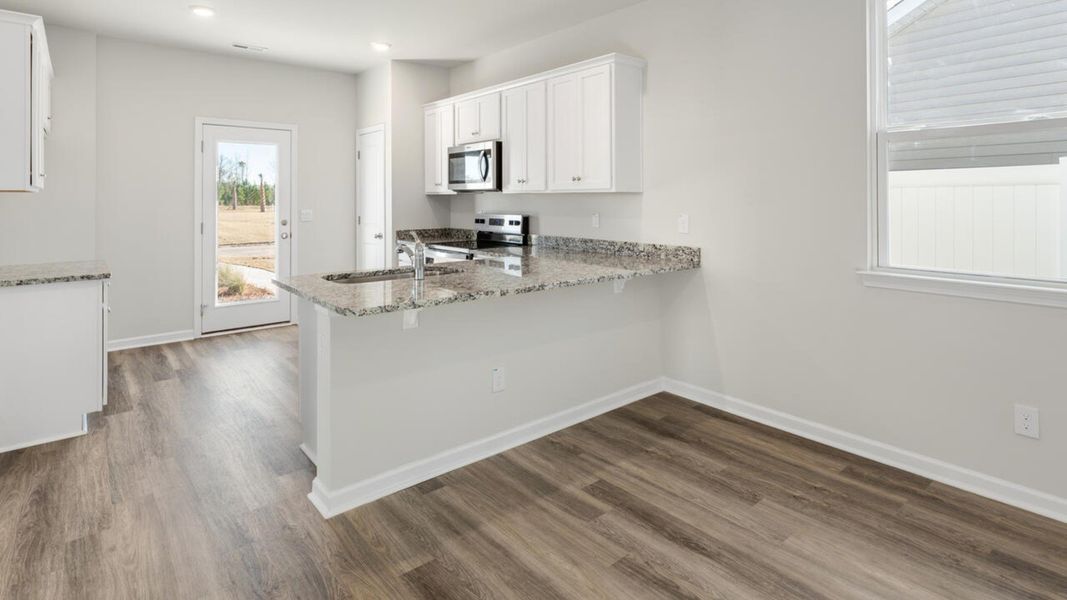 Representative furnished interior of a home built from the DELANEY by D.R. Horton in The Cottages at Blake Farm, Wilmington (Image 12). Representative furnished interior of a home built from the DELANEY by D.R. Horton in The Cottages at Blake Farm, Wilmington (Image 12).