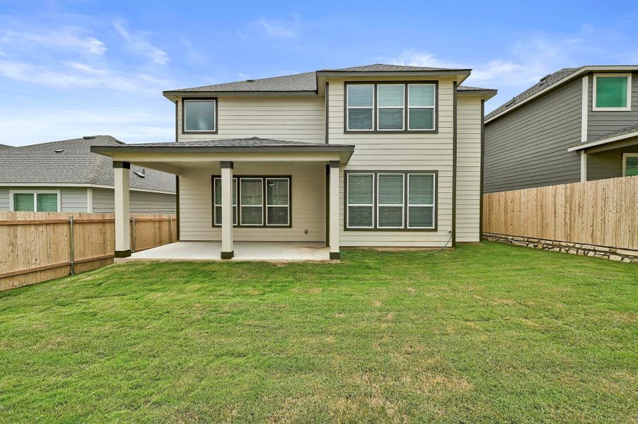 Front exterior of a new home in McKinney Crossing, Austin, TX, highlighting curb appeal (Image 19). Front exterior of a new home in McKinney Crossing, Austin, TX, highlighting curb appeal (Image 19).